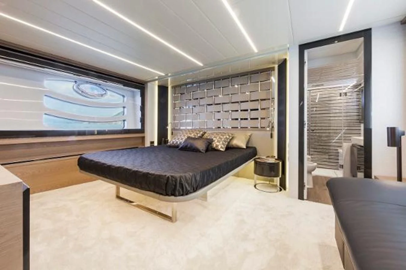 a large room with a bed and a tv aboard STAR Yacht for Sale