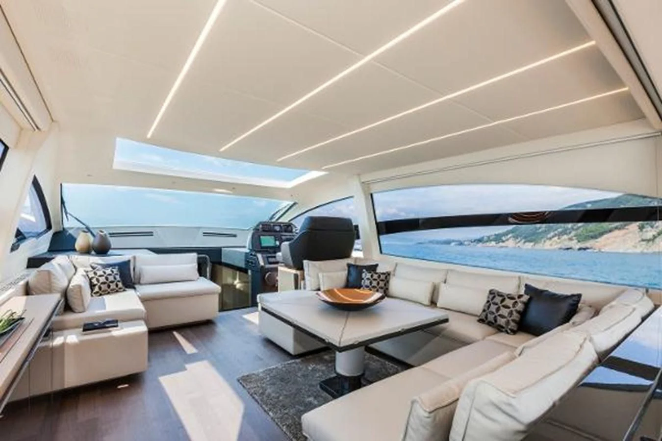 a living room with a bed and a couch aboard STAR Yacht for Sale