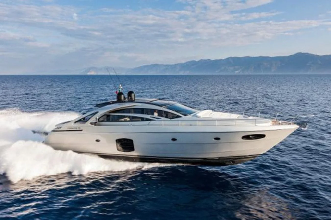 a white yacht on the water aboard STAR Yacht for Sale