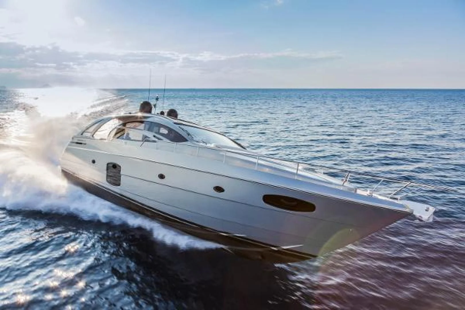 a white yacht on the water aboard STAR Yacht for Sale