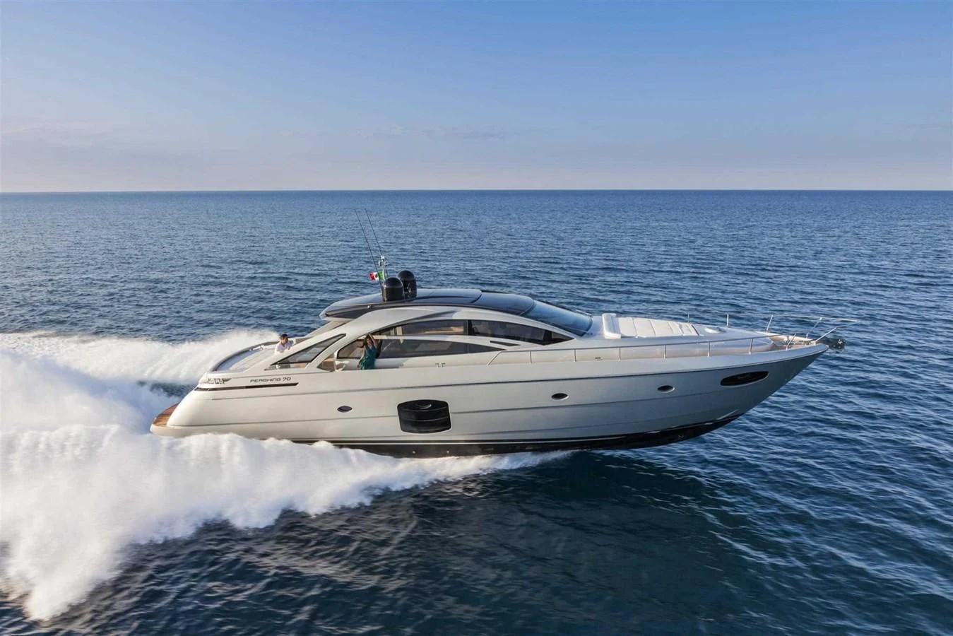 a white yacht on the water aboard STAR Yacht for Sale