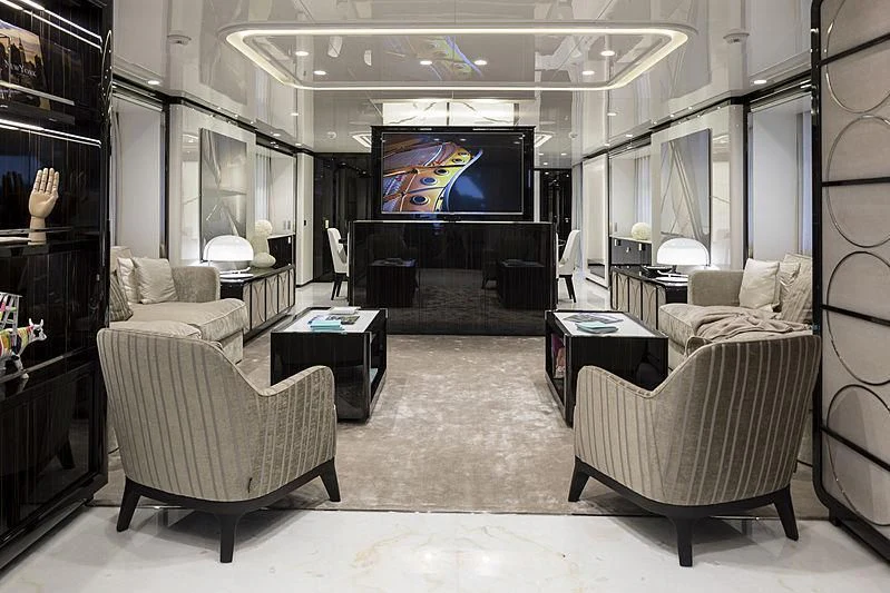 a living room with a large screen aboard ANDIAMO Yacht for Sale