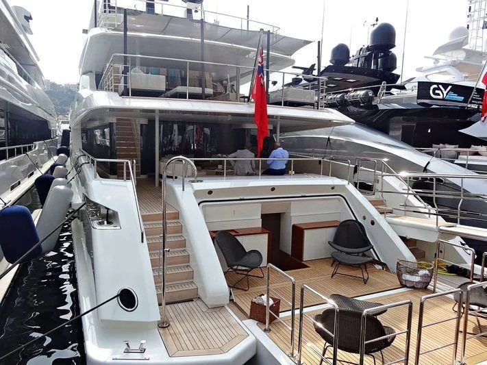 a boat with a deck and chairs aboard ANDIAMO Yacht for Sale