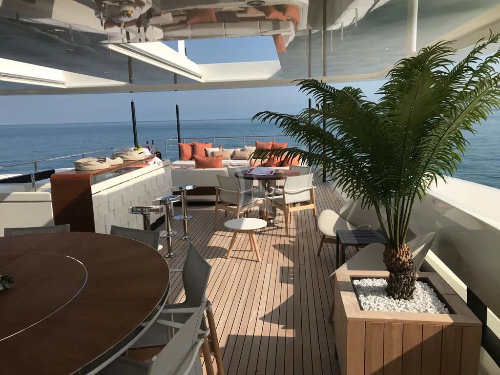 a room with a table and chairs aboard ANDIAMO Yacht for Sale