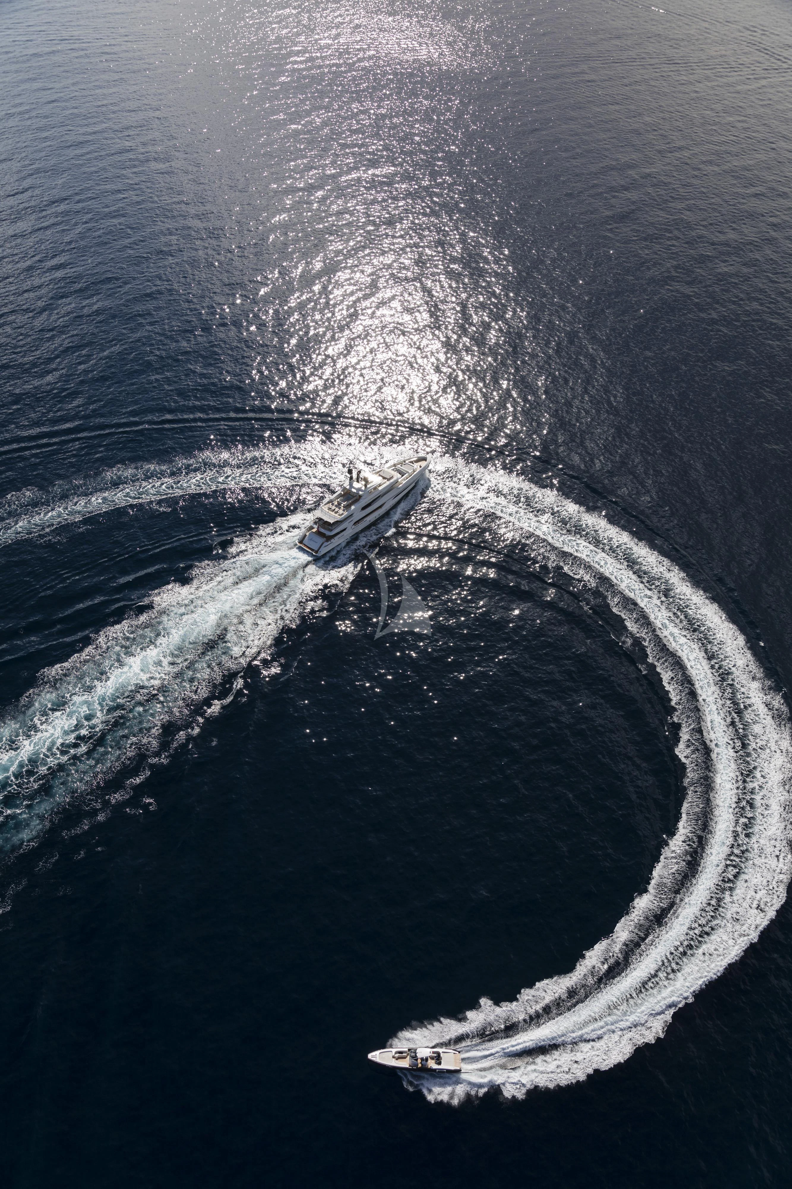 a helicopter flying over a beach aboard ANDIAMO Yacht for Sale