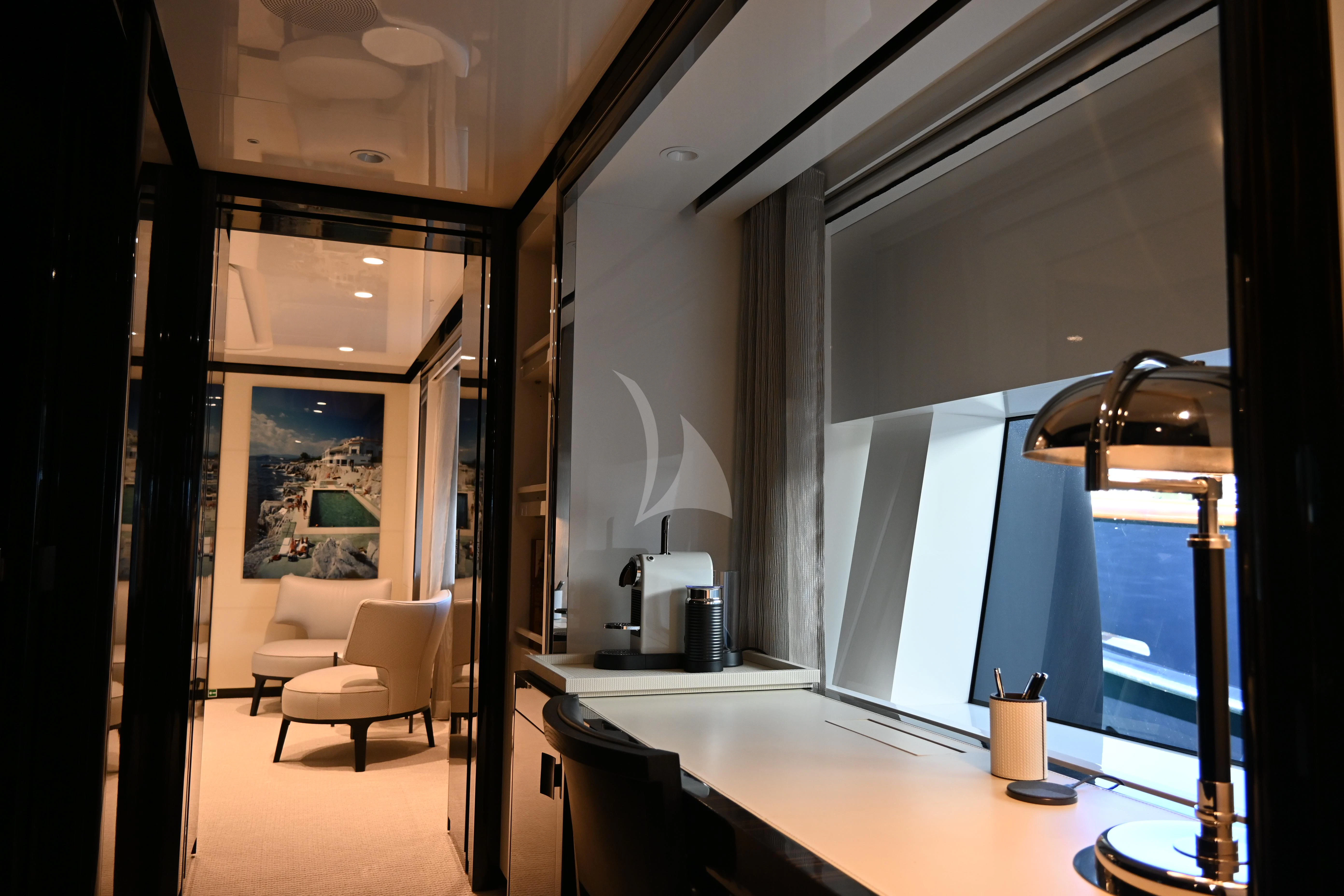 a modern looking room with a glass door aboard ANDIAMO Yacht for Sale