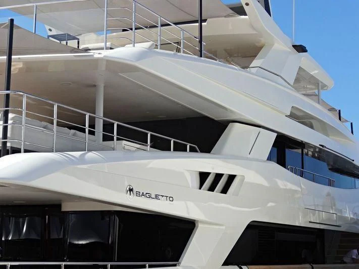 a white boat with a black and white stripe aboard ANDIAMO Yacht for Sale