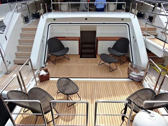 a room with chairs and a table aboard ANDIAMO Yacht for Sale