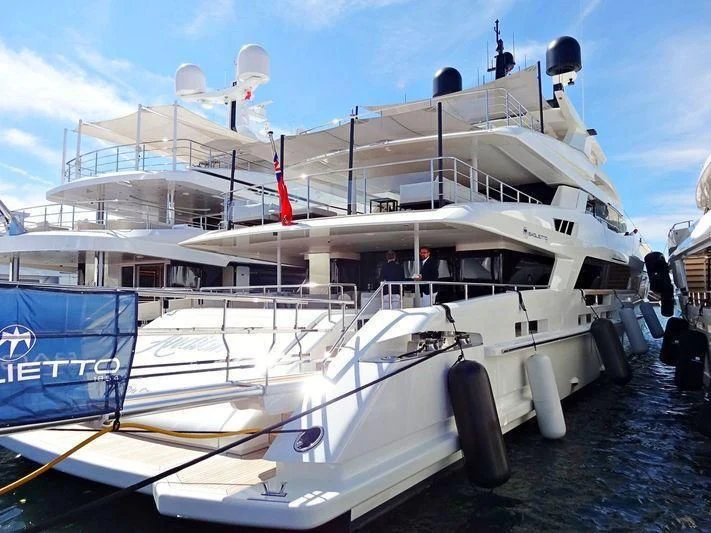 a boat docked at a pier aboard ANDIAMO Yacht for Sale