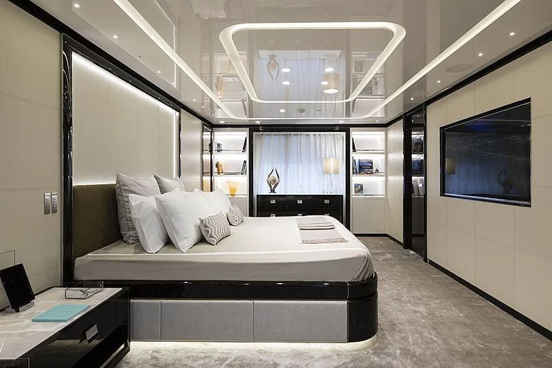 a room with a bed and a tv aboard ANDIAMO Yacht for Sale
