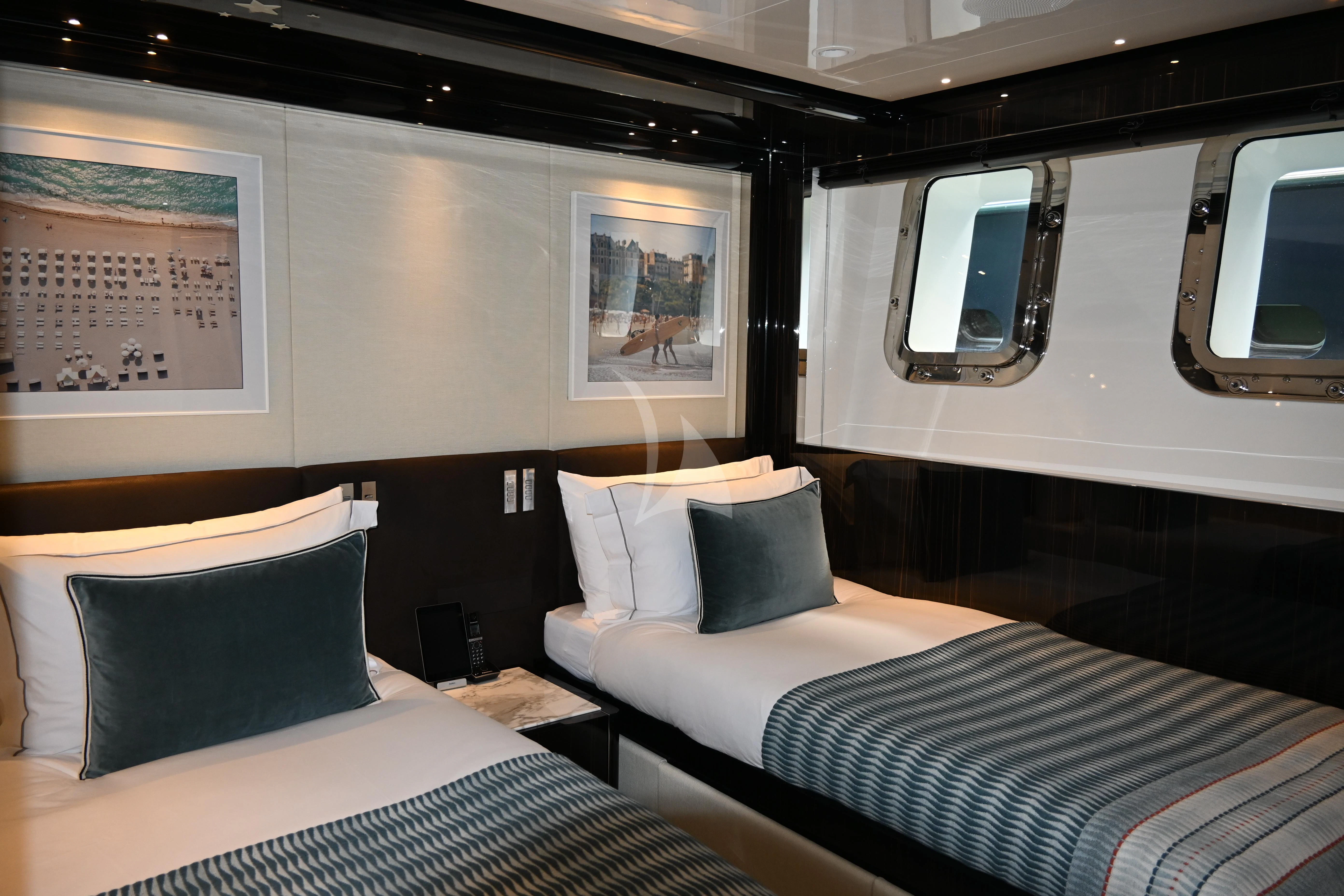 a couple of beds in a room aboard ANDIAMO Yacht for Sale