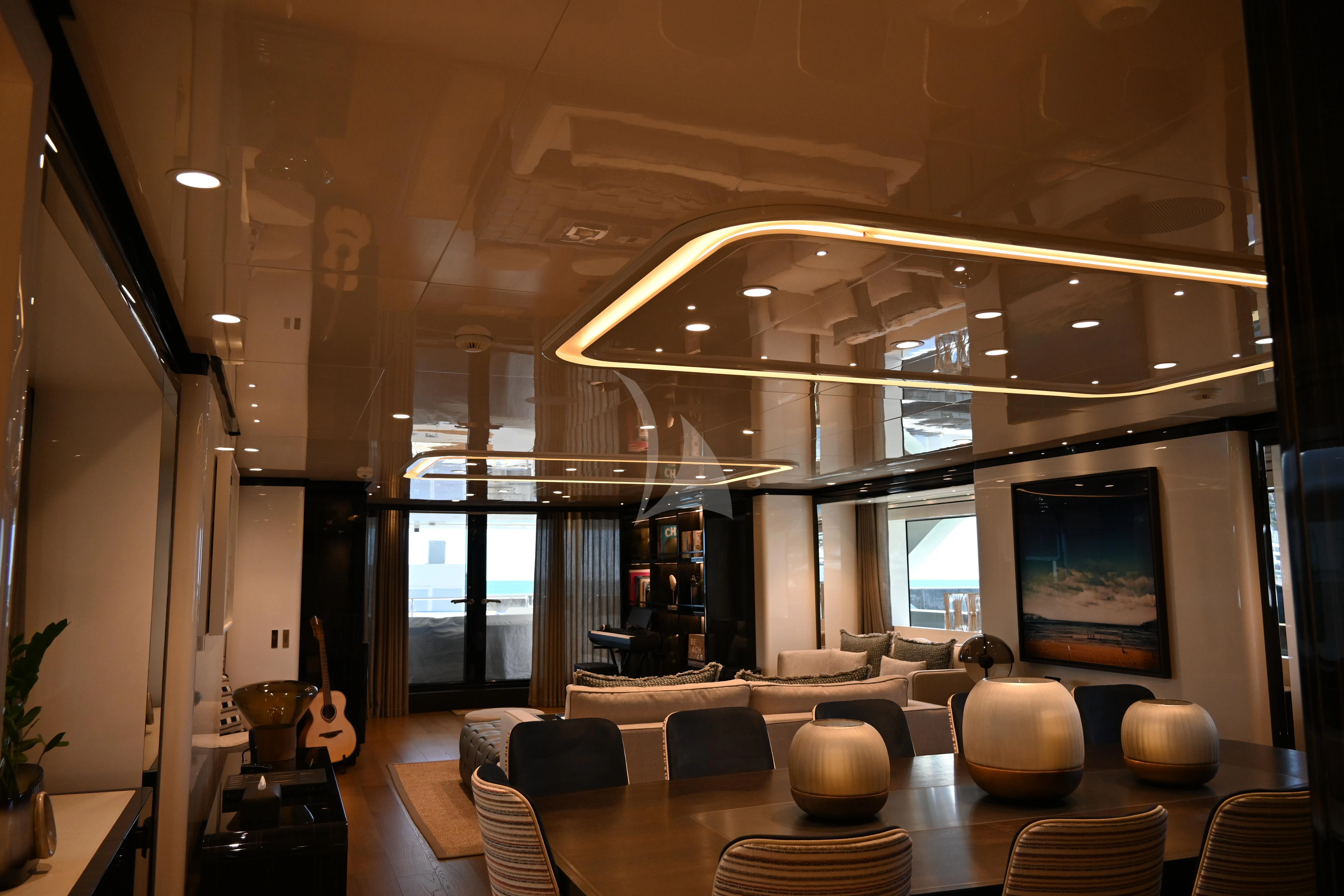 a room with a large window and a wood floor aboard ANDIAMO Yacht for Sale