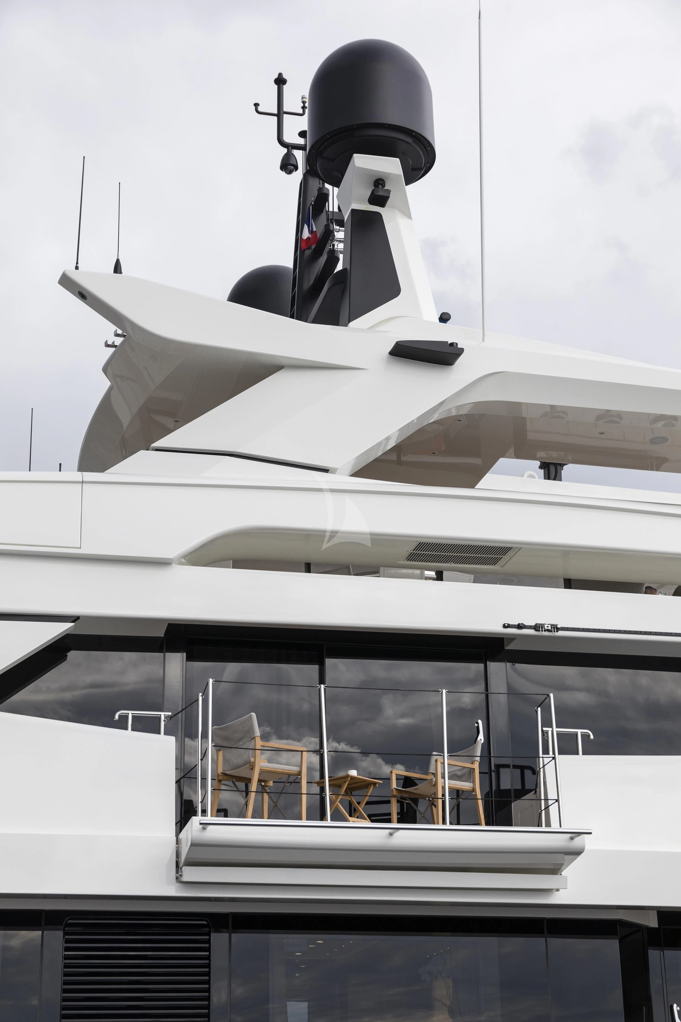 a jet plane flying over a building aboard ANDIAMO Yacht for Sale