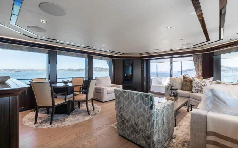 a living room with a large window aboard FIGARO Yacht for Sale