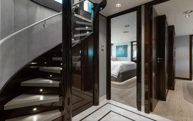 a room with a bed and a staircase aboard FIGARO Yacht for Sale
