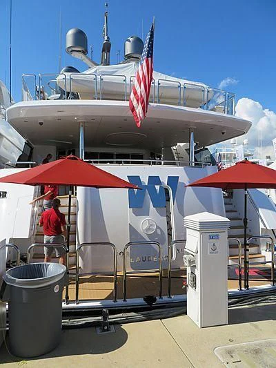 a large boat with a red stripe aboard FIGARO Yacht for Sale