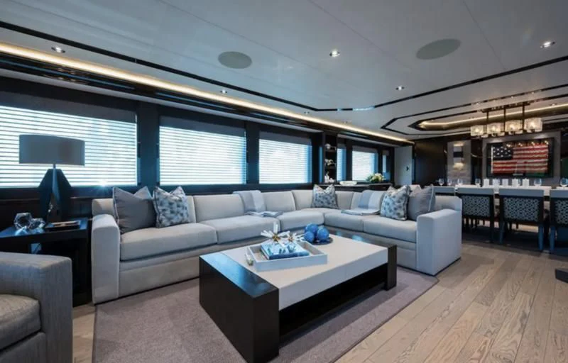 a living room with a large window aboard FIGARO Yacht for Sale
