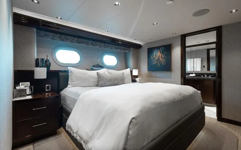 a room with two beds aboard FIGARO Yacht for Sale