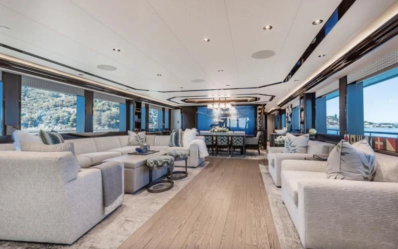 a living room with a large window aboard FIGARO Yacht for Sale
