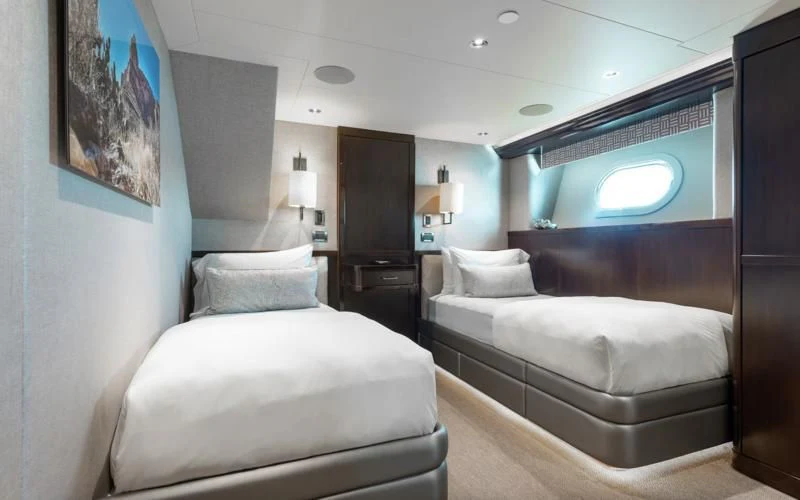 a room with two beds aboard FIGARO Yacht for Sale