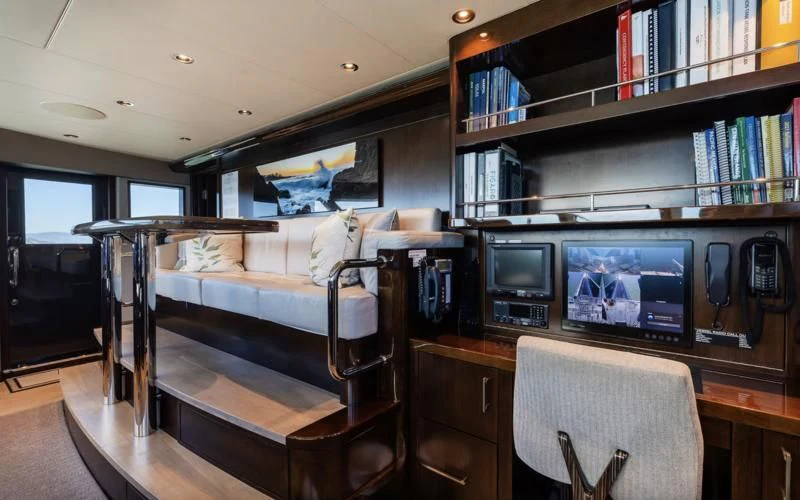 a room with a bed and a tv aboard FIGARO Yacht for Sale