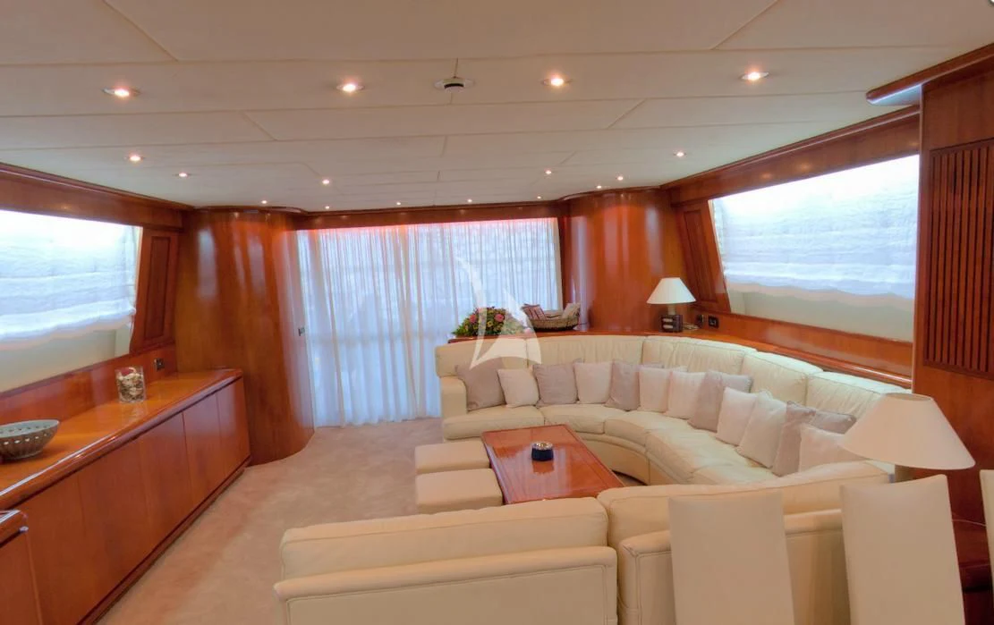 a living room with a couch and a table aboard ABSOLUTE KING Yacht for Sale