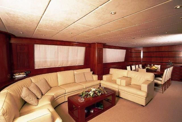 a living room with a couch and a table aboard ABSOLUTE KING Yacht for Sale
