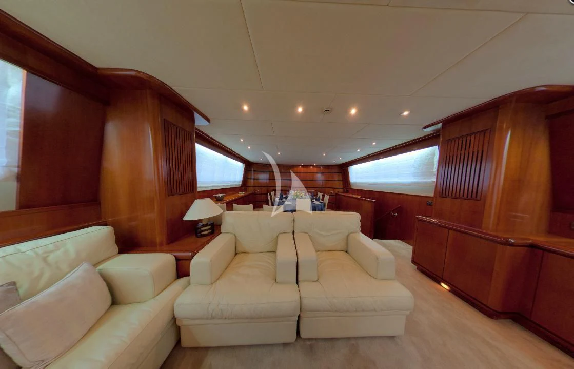 a room with a couch and a wood wall aboard ABSOLUTE KING Yacht for Sale