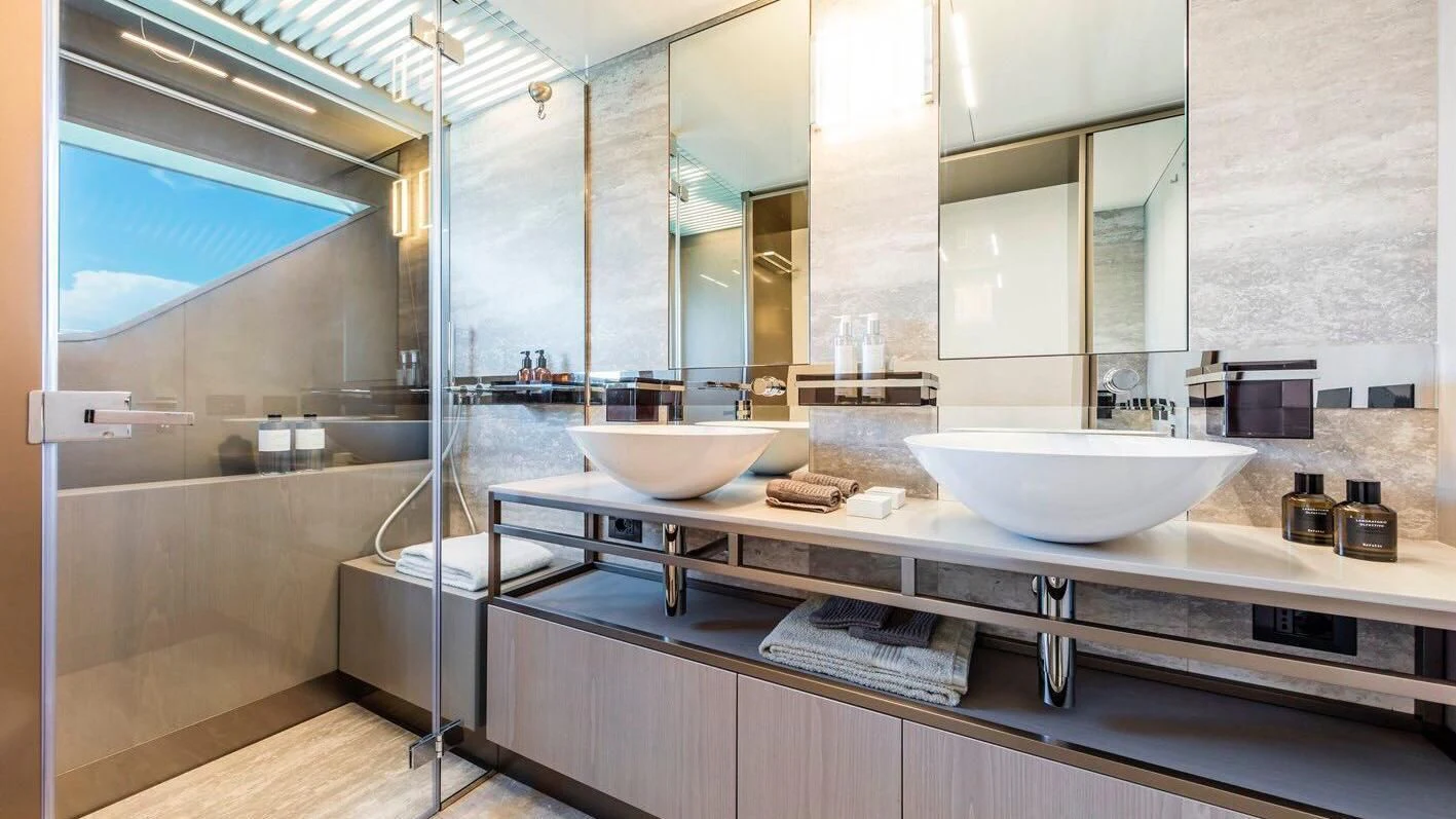 a bathroom with a large mirror aboard TO INDIA Yacht for Sale