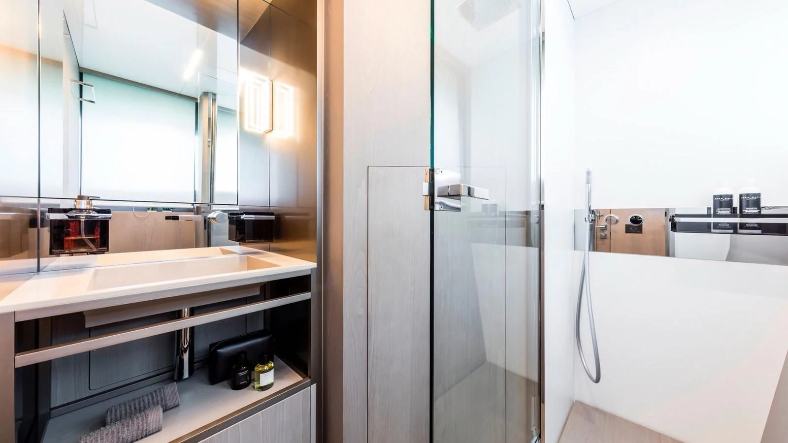 a bathroom with a glass shower aboard TO INDIA Yacht for Sale
