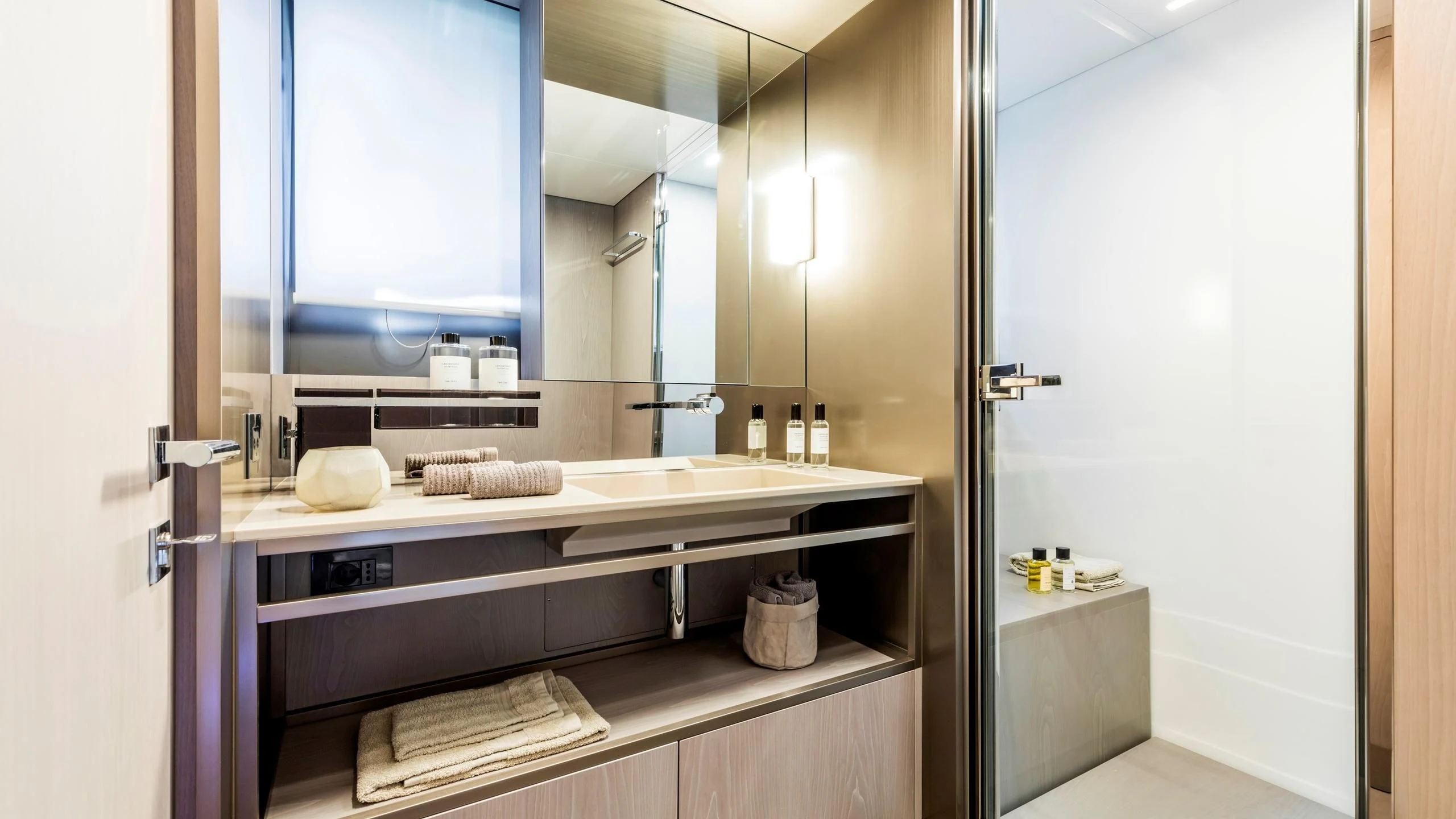 a bathroom with a countertop sink and mirror aboard TO INDIA Yacht for Sale