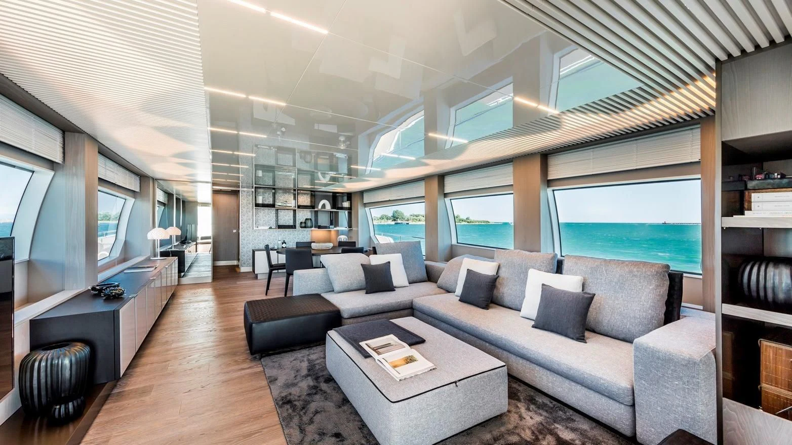 a living room with a large window aboard TO INDIA Yacht for Sale
