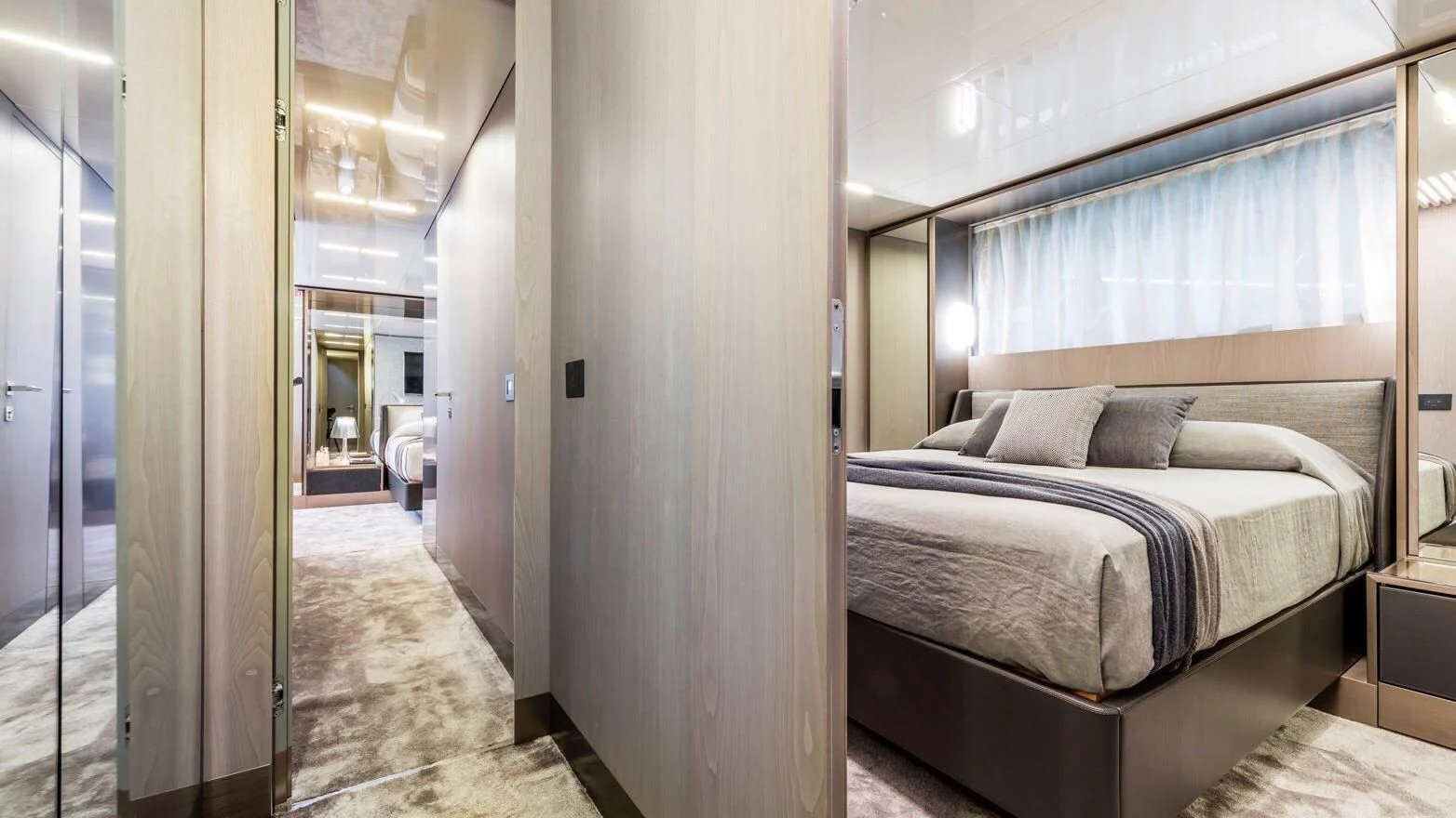 a bedroom with a bed and a mirror aboard TO INDIA Yacht for Sale