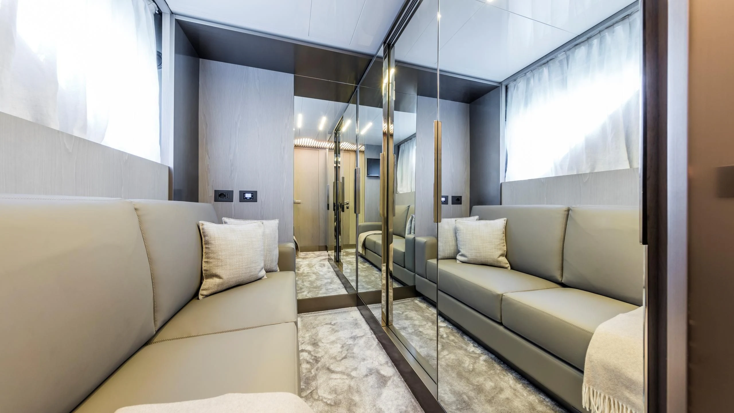 a living room with a glass door aboard TO INDIA Yacht for Sale