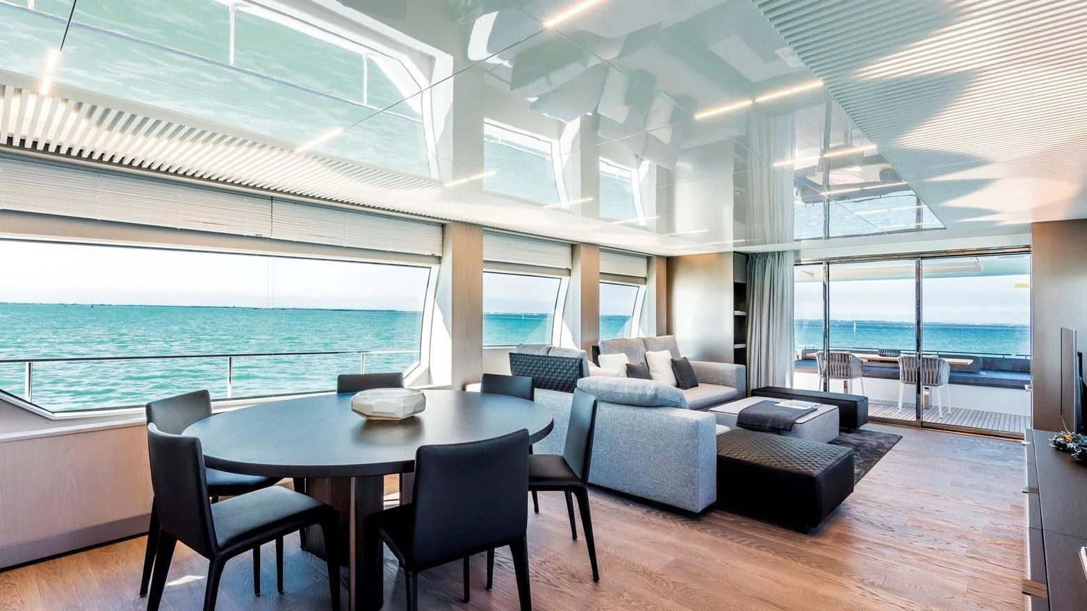 a room with a table and chairs aboard TO INDIA Yacht for Sale