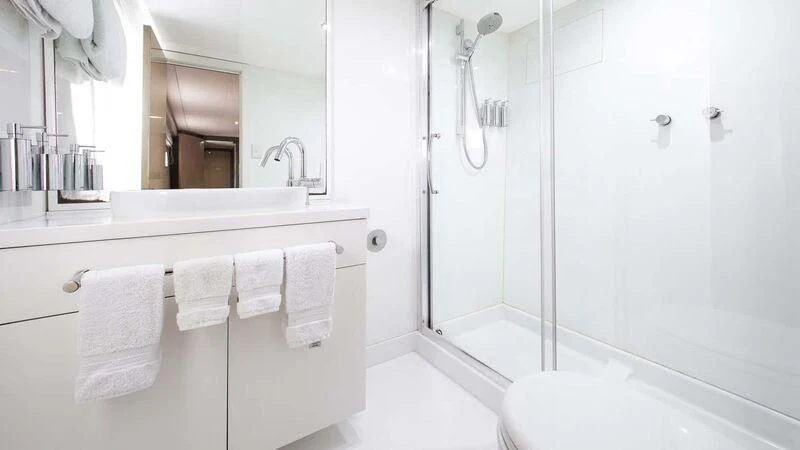 a bathroom with a shower and a sink aboard OCEAN DREAM Yacht for Sale