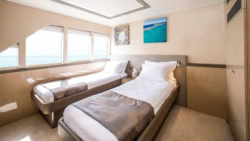 a room with two beds aboard OCEAN DREAM Yacht for Sale