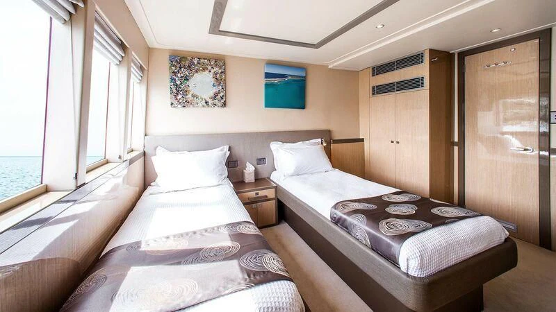 a couple of beds in a room aboard OCEAN DREAM Yacht for Sale