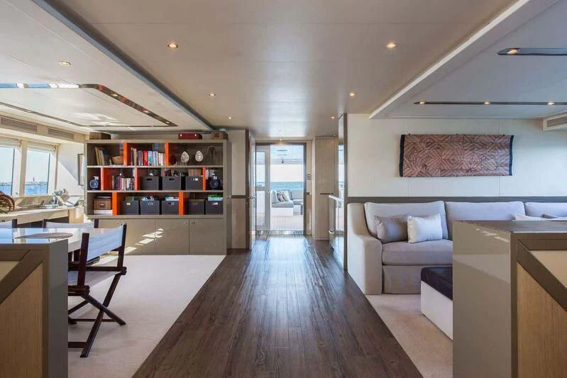 a large living room with a wood floor and a wood floor aboard OCEAN DREAM Yacht for Sale