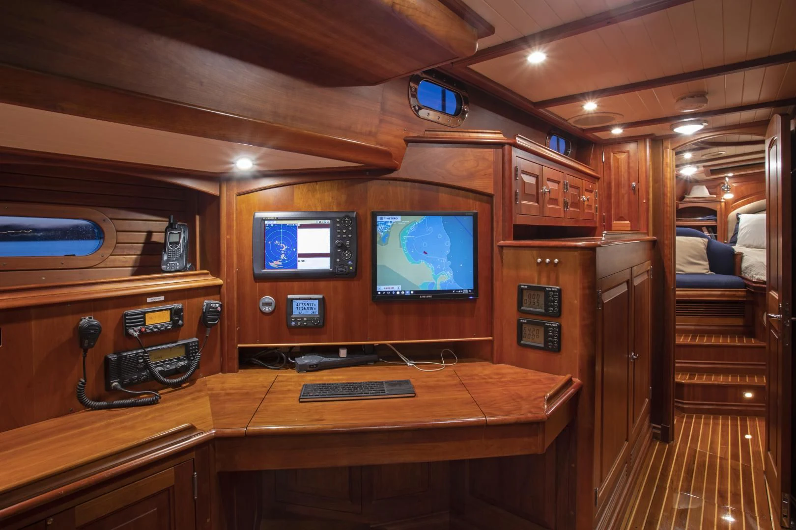 a room with a desk and a television aboard PATRIOT Yacht for Sale