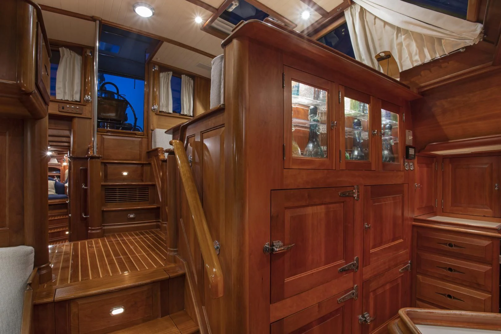 a wooden cabinet with drawers aboard PATRIOT Yacht for Sale