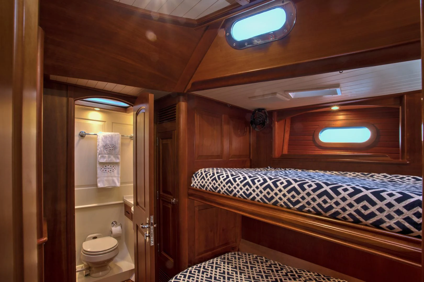 a bathroom with a large bed aboard PATRIOT Yacht for Sale