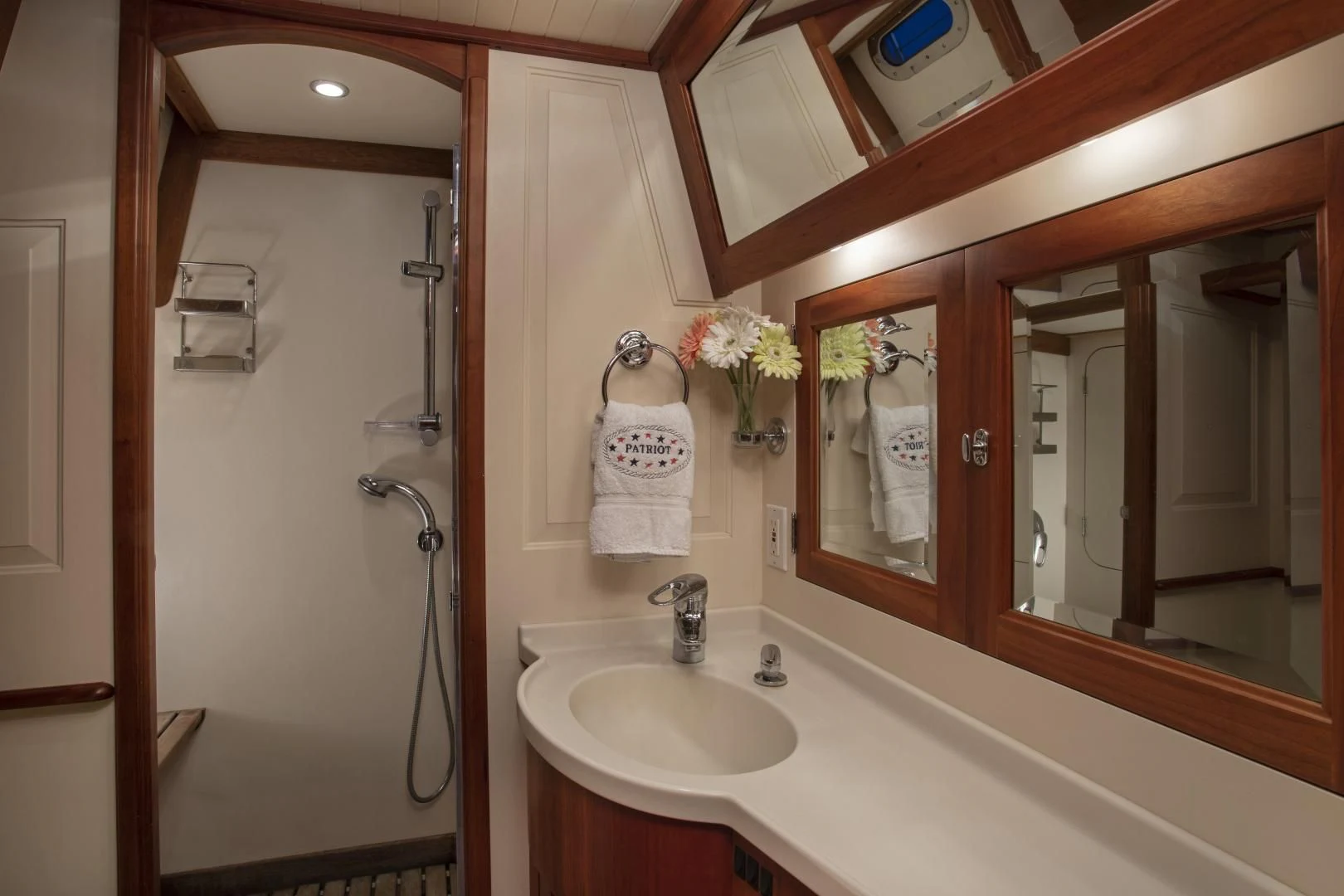 a bathroom with a sink and a mirror aboard PATRIOT Yacht for Sale