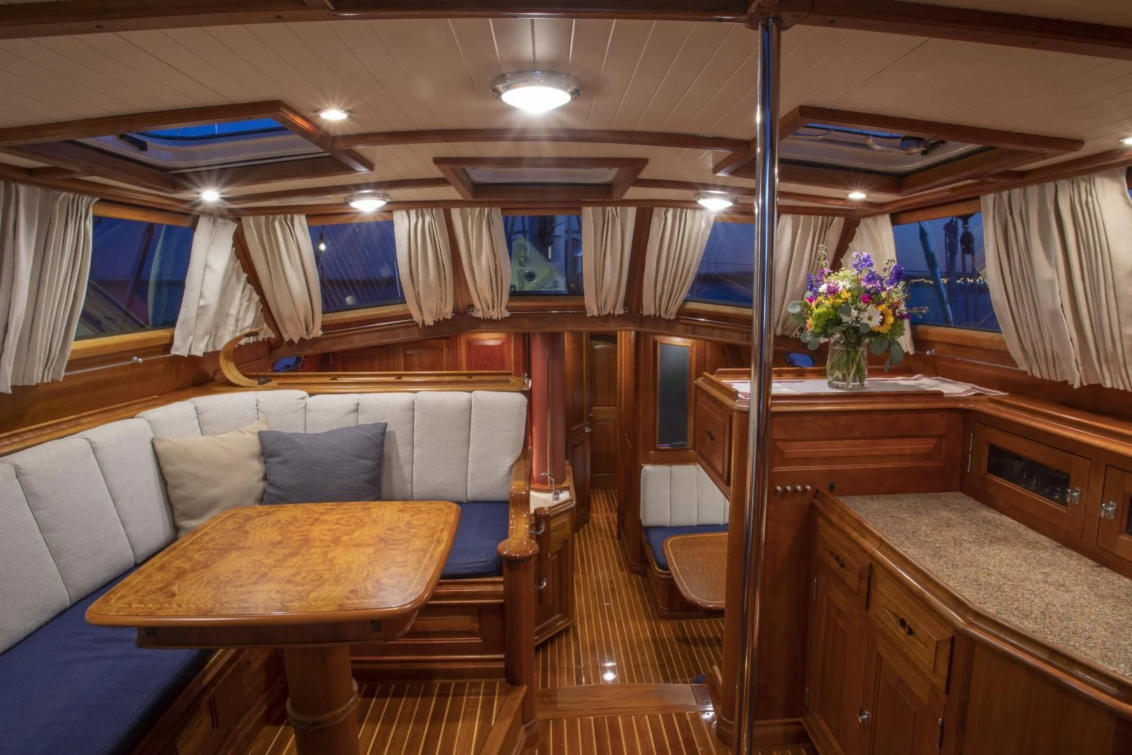 a room with a couch and a table aboard PATRIOT Yacht for Sale