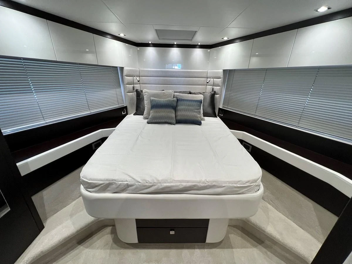 a room with a bed and a window aboard 66 MANHATTAN Yacht for Sale