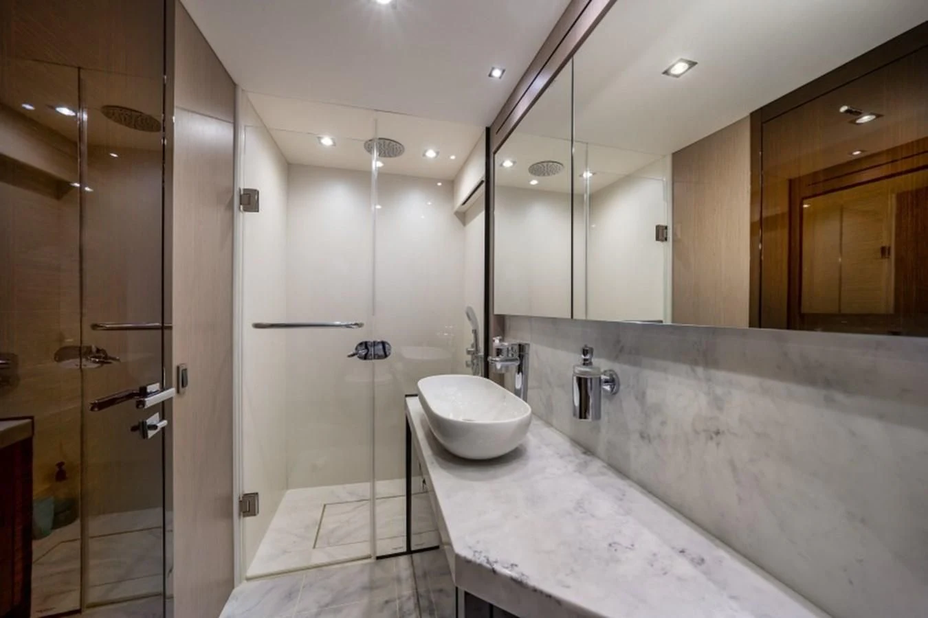 a bathroom with a large marble countertop aboard 66 MANHATTAN Yacht for Sale