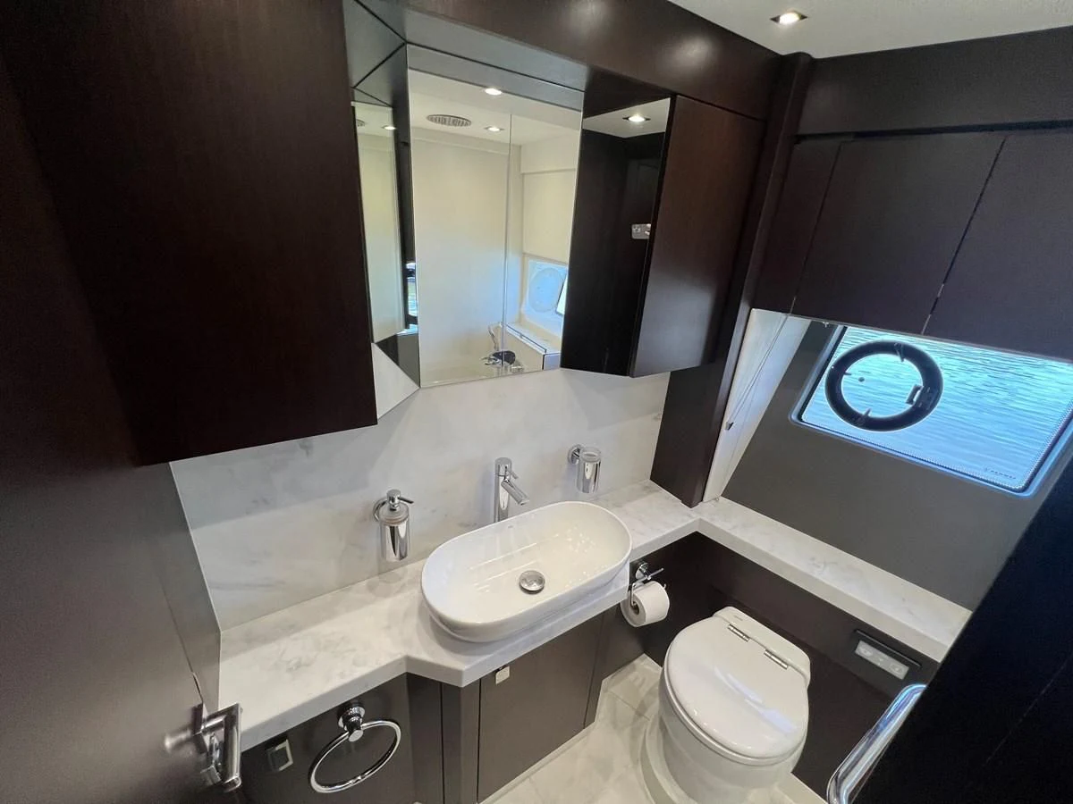 a bathroom with a large mirror aboard 66 MANHATTAN Yacht for Sale
