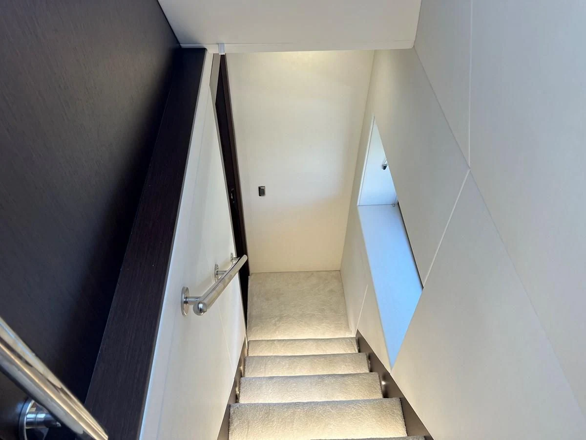 a hallway with a door aboard 66 MANHATTAN Yacht for Sale