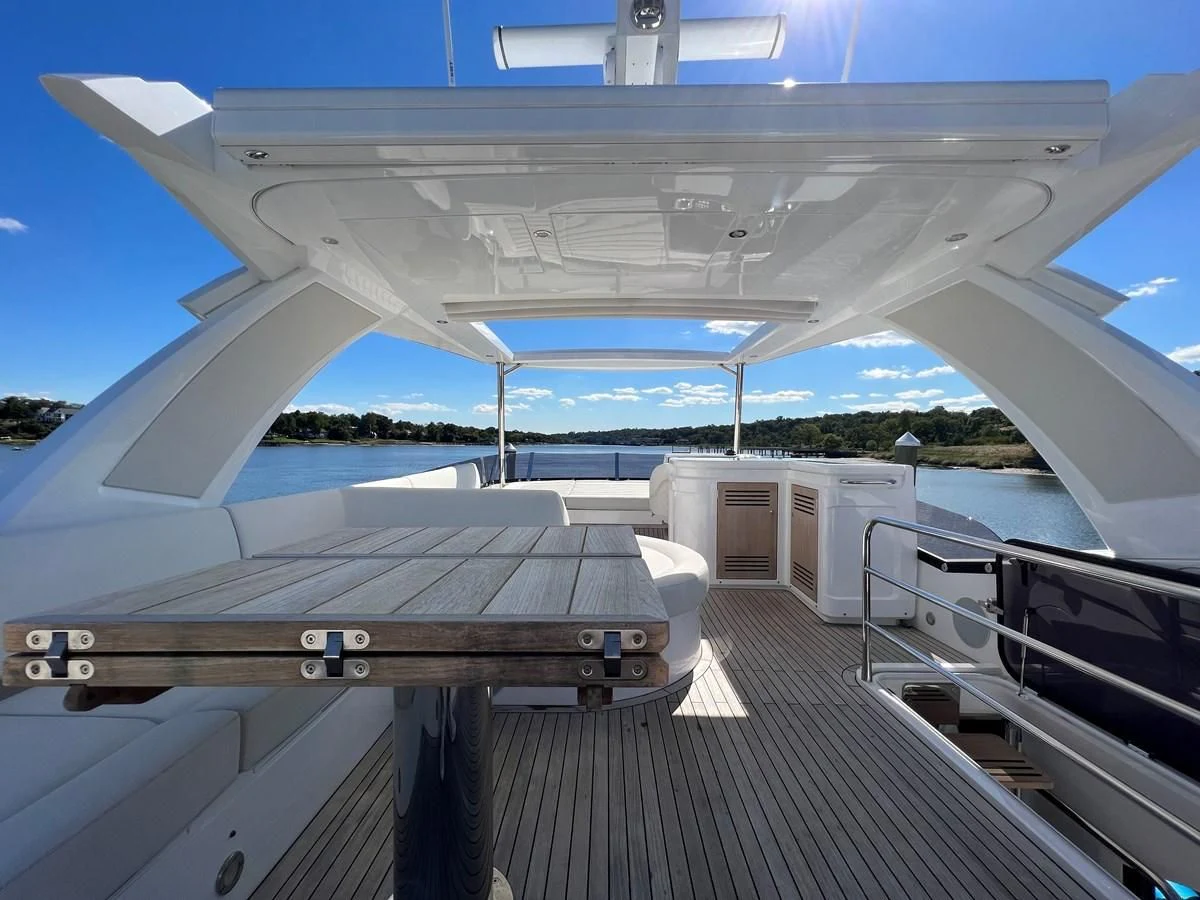 a deck with a pool and a deck aboard 66 MANHATTAN Yacht for Sale