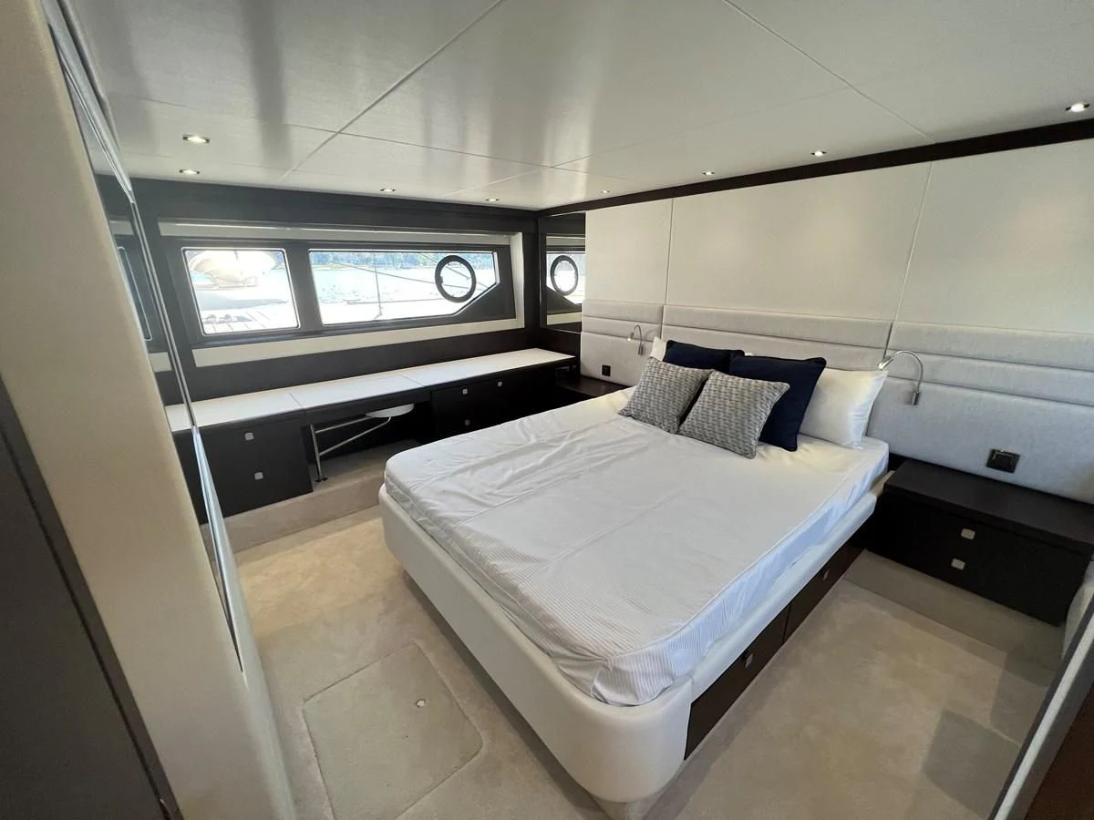 a room with a bed and a tv aboard 66 MANHATTAN Yacht for Sale